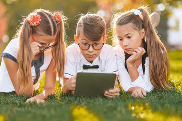 children study and take tests on the tablet