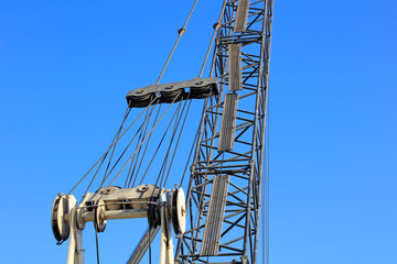 crane arm under blue sky