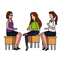 elegant businesswomen seated in benchs