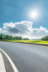 Country road and green woods nature landscape in summer