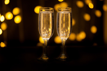 Glasses with a drink on a background of illumination