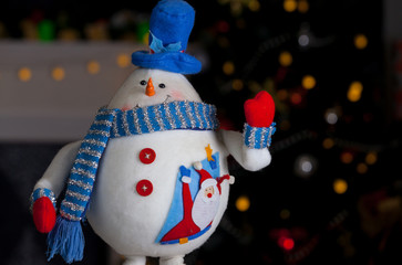 Snowman on the background of illumination