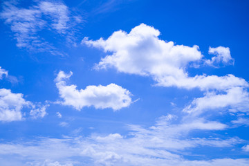 Obraz na płótnie Canvas White clouds in the dark blue sky in the sunlight
