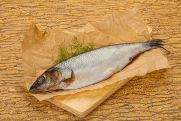 Salted herring over the wooden board