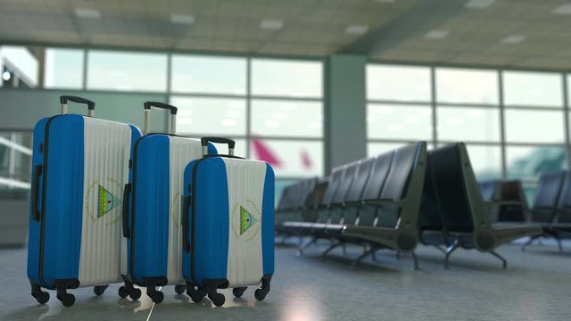Travel suitcases with flag of Nicaragua. Nicaraguan tourism conceptual 3D animation
