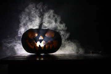 Halloween pumpkin smile and scrary eyes for party night. Close up view of scary Halloween pumpkin...