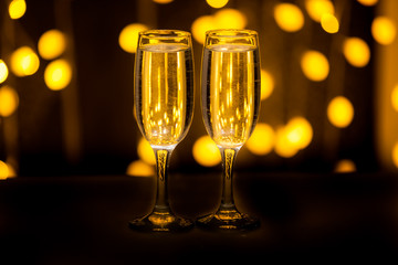 Two glasses on a background of illumination