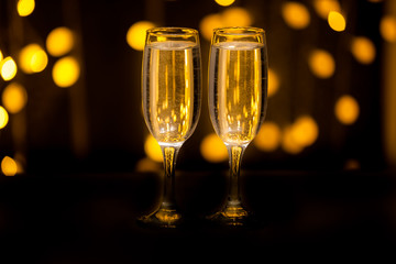 Two glasses on a background of illumination