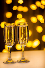 Two glasses on a background of illumination