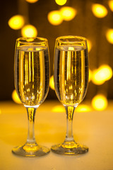 Two glasses on a background of illumination