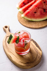 A refreshing summer drink of watermelon juice with lime and ice
