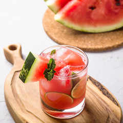 A refreshing summer drink of watermelon juice with lime and ice
