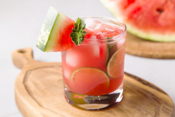 A refreshing summer drink of watermelon juice with lime and ice