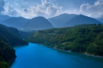 Aerial view Lake Santa Giustina, Castel Cles, bridge over the lake. North of Italy. - obrazy, fototapety, plakaty