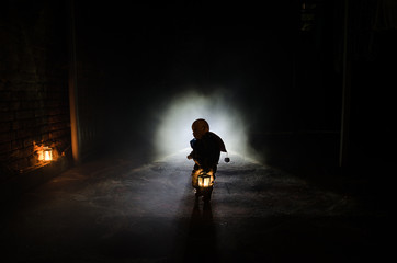 Horror scene of a scary children's ghost, Silhouette of scary baby doll on dark foggy background...