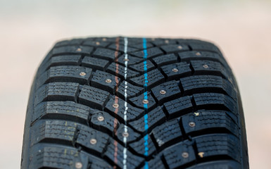 Brand new winter tyre. Studded tyre for slippery and icy roads.