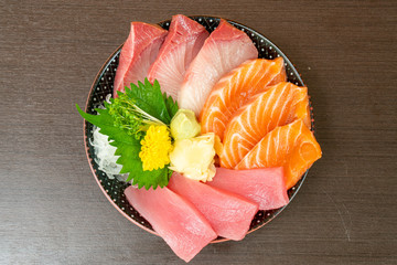 fresh salmon, tuna and hamachi on topped rice bowl (donburi)