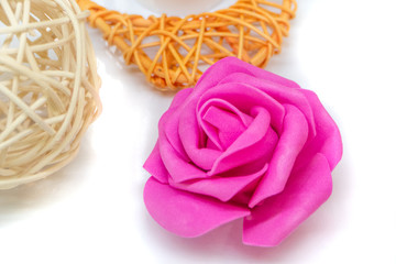 Rattan ball and flower on white