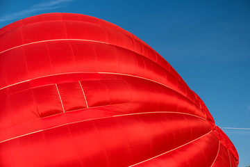 Detail of a starting red hot air balloon