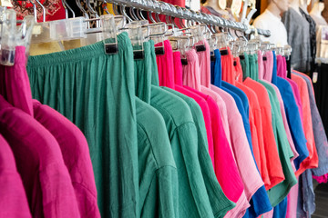 Colorful row of clothes on hangers