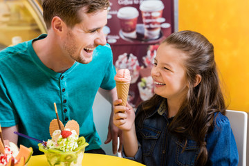 Dad and daughter eating ice cream