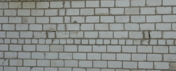Brick wall. The window in the wall. Angled view. Overall plan..