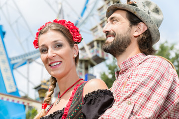 Man and woman in Tracht on the Oktoberfest in Munich