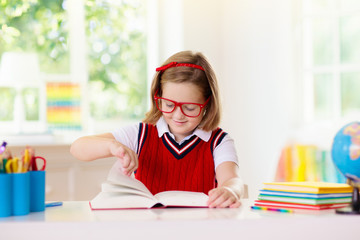 Kids doing homework. Children go back to school.