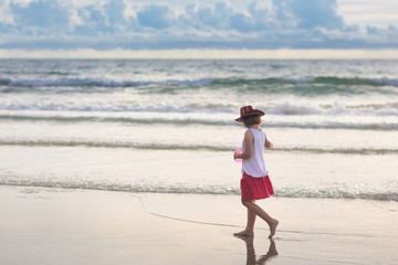Kids play on tropical beach. Sand and water toy.
