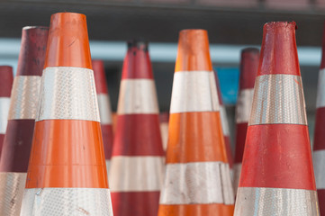 Red and orange traffic cones used to signal construction sites and make detours