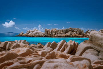 Seychelles La Digue. Scenery of amazing huge shaped granite rocks stones and blue turquoise ocean...