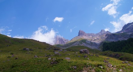 Summits and clouds in French alps, in the 