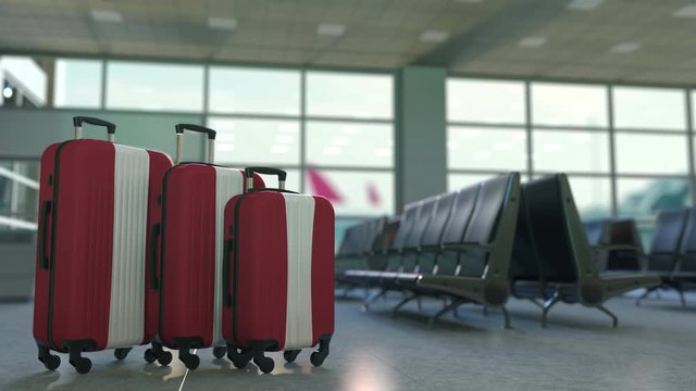 Travel suitcases with flag of Latvia. Latvian tourism conceptual 3D animation