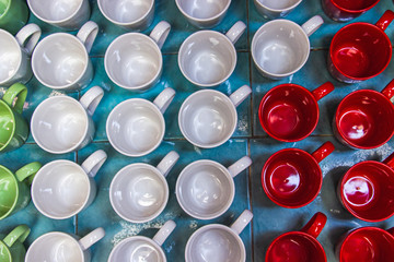 Colorful ceramic glass mug in different shape and form. Top view