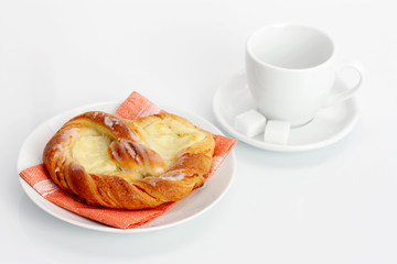 Cheese Danish and empty cup of coffee