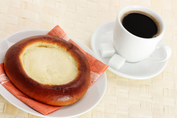 cup of coffee and Cheese Danish on white background