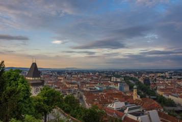 Fototapeta premium Cityscape of Graz and the famous clock tower (Grazer Uhrturm) on Shlossberg hill, Graz, Styria region, Austria