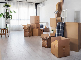 Moving in new home. home interior full of box containers and stuff