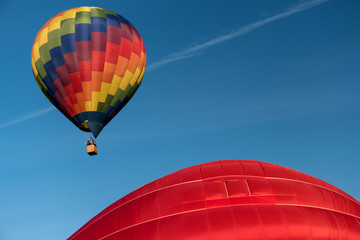 Fototapeta na wymiar Detail of a starting colorful hot air balloon