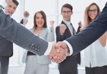 close up.handshake business partners on blurred office background