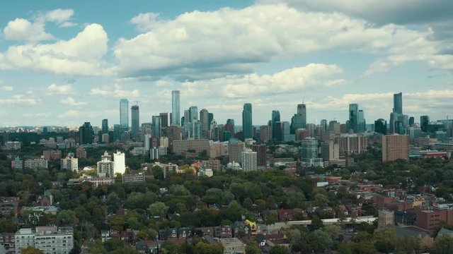 Aerial establishing shot of residential areas in a large metropolitan city. Cinematic 4K footage.