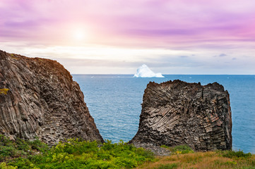 Basalt cliffs on the shore of Atlantic ocean on Disco island, western Greenland