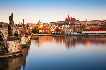 View of  Old Town with Prague Castle and Charles Bridge at sunrise in Prague, Czech Republic. Famous travel destination