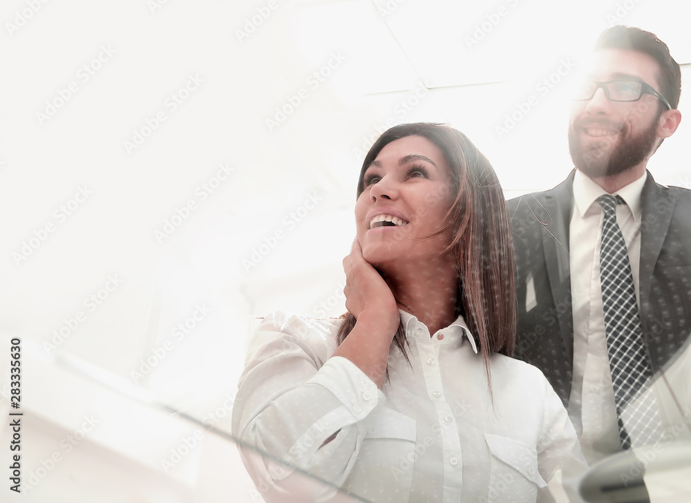 Poster through the glass.business colleagues at the Desk