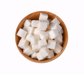 Top view of white pure sugar cubes in wooden bowl isolated on white background