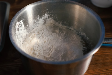 Fototapeta na wymiar flour in bowl, kneading dough, puff pastry dough manufacturing p