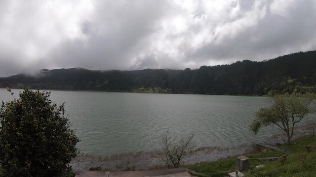 Furnas Lake in volcanic crater. Erupting geysers, mud pools and fumaroles in Furnas province on Sao Miguel Island, Azores, Portugal, make it a popular tourist destination.
