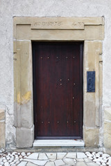 Fototapeta na wymiar Wooden Door in Medieval Church. 15th Century. Church St. Rocha in the Stary Sacz, Poland.