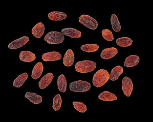 Fototapeta premium Dried raisins isolated on black background