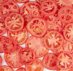 Obraz na płótnie Canvas Healthy natural food, background. Tomatoes slices. Square.